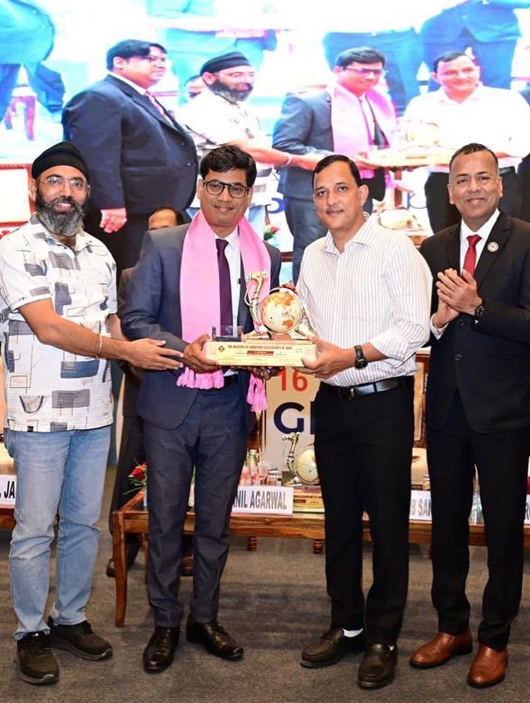 CA Arun Agarwal receiving a trophy from the Institute of Chartered Accountants of India at the 16th ICAI Global Orbit in Jaipur